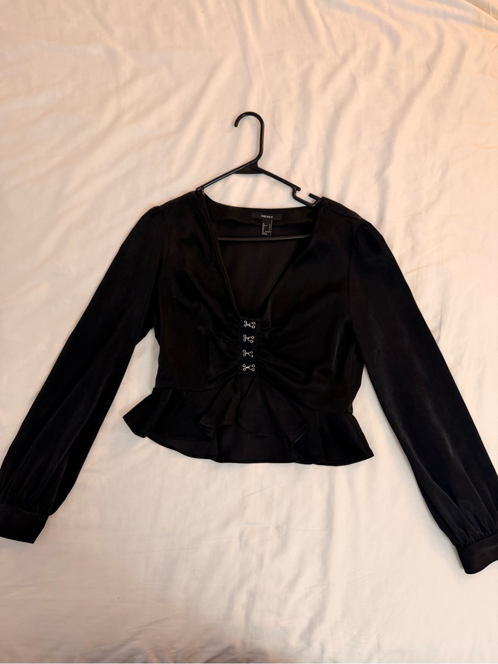 Black Long-Sleeve Peplum Top with Hook Front